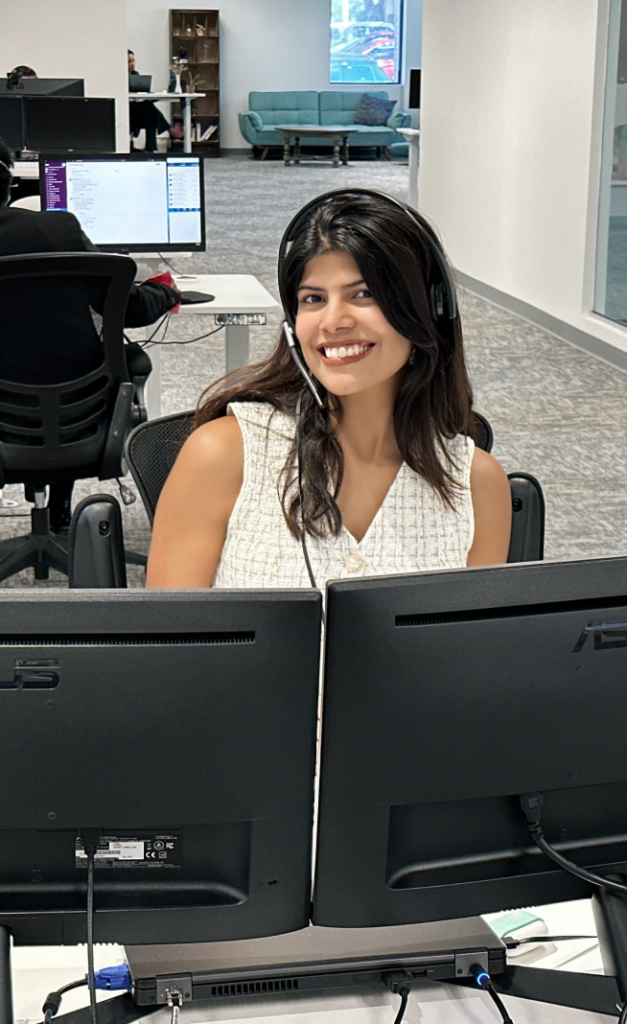woman smiling wearing headset and willing to help, customer service