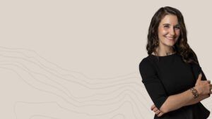 Hero image of Sabrina with her arms crossed and smiling