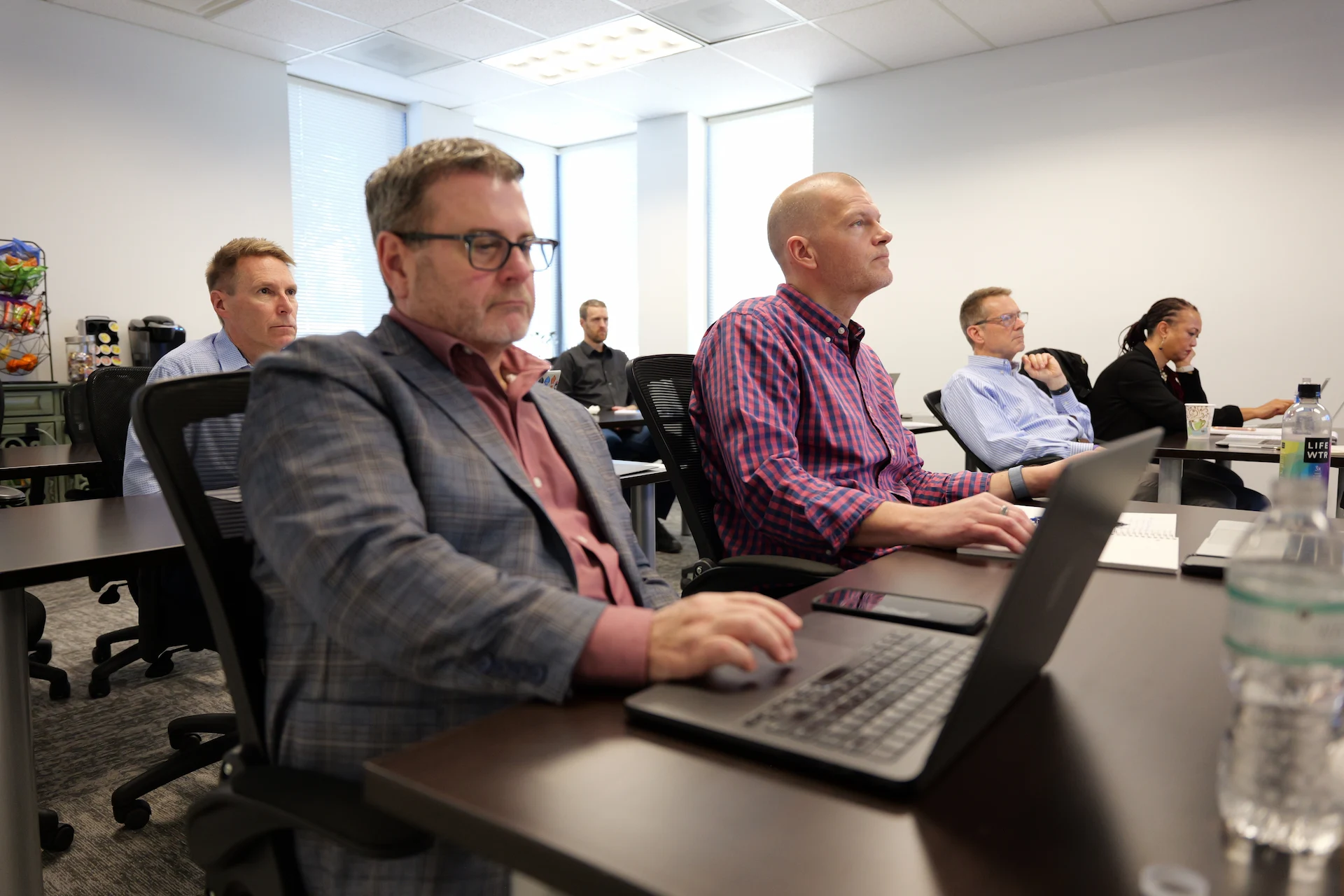 Franchise professional taking notes during an FBA training session